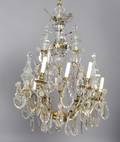 A Group of Two Gilt Metal NineLight Chandeliers