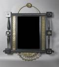 An Ebonized and Gilt Metal Mounted Mirror