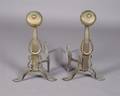 A Pair of Hammered Metal Andirons