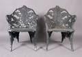 A Pair of Wrought Iron Arm Chairs