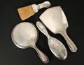 GROUP OF FOUR ASSORTED STERLING SILVER DRESSING ARTICLE