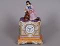 CONTINENTAL PORCELAIN MANTEL CLOCK