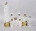 A Group of English Cut Glass and Sterling Silver Perfume Bottles