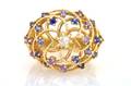 An 18 Karat Yellow Gold Purple Sapphire and Diamond Ring