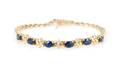 An 18 Karat Yellow Gold Blue Sapphire and Diamond Bracelet