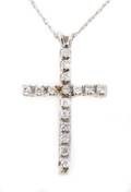 A 14 Karat White Gold Diamond Cross Pendant With Chain