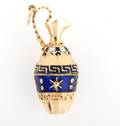 An 18 Karat Yellow Gold and Blue Enamel Pitcher Charm
