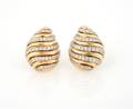 A Pair of 14 Karat Yellow Gold and Diamond Earrings