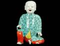 FAMILLE ROSE PORCELAIN FIGURE OF A HOHO BOY