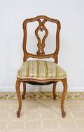 A Set of Six Carved Side Chairs