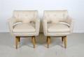 A Pair of American Swivel Arm Chairs Dunbar