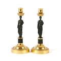 A Pair of Bronze Empire Candlesticks