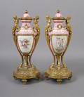 A Pair of French Porcelain and Ormolu Mounted Urns