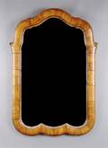 A Continental Parcel Gilt Walnut Mirror