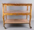 A Louis XVI Style Acajou Satinwood and Gilt Metal Mounted Tea Cart