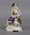 A Porcelain Figure of a Seated Gentleman