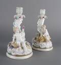 A Pair of Continental Porcelain Figural Candlesticks