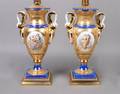 A Pair of Continental Gold and Porcelain Vases