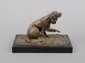 A Bronze Sculpture of a Dog