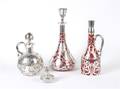 A Collection of Four Silver Overlay Bottles