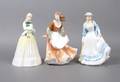 A Group of Three Royal Doulton Porcelain Figures