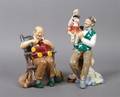 A Group of Two Royal Doulton Porcelain Figures