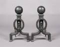 A Pair of Hammered Iron Andirons