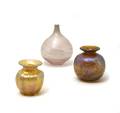 A Collection of Three Iridescent Glass Vases