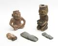 A Collection of PreColumbian Style Seated Figures