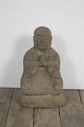 A Seated Stone Figure of Buddha