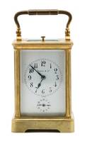 A Brass and Glass Carriage Clock retailed by Tiffany and Co