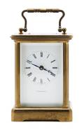 A Brass and Glass Carriage Clock retailed by Tiffany and Co