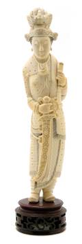 A Carved Ivory Figure of a Female Figure