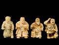 GROUP OF FOUR CARVED IVORY NETSUKES