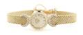 A 14 Karat Yellow Gold and Diamond Wristwatch Le Bolt