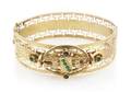 A 14 Karat Yellow Gold and Seed Pearl Hinged Bangle Bracelet