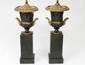 PAIR OF EMPIRE STYLE PATINATED AND GILT BRONZE URNS