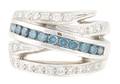 An 18 Karat White Gold Irradiated Blue Diamond and White Diamond Ring