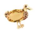A 14 Karat Yellow Gold Citrine and Garnet Bird Pin