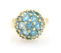 An 18 Karat Yellow Gold and Blue Topaz Ring