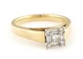 A 14 Karat Yellow and White Gold and Diamond Ring
