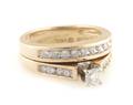 A 14 Karat Yellow Gold and Diamond Ring