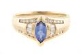 A 14 Karat Yellow Gold Tanzanite and Diamond Ring