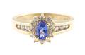 A 14 Karat Yellow Gold Tanzanite and Diamond Ring