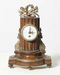 A Neoclassical Style Mahogany and Gilt Metal Mounted Clock