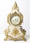 A Neoclassical Style Onyx and Gilt Metal Mounted Mantle Clock