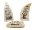 A Group of Three Scrimshaw Whales Teeth