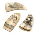 A Group of Three Scrimshaw Whales Teeth