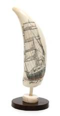 A Scrimshaw Whales Tooth Depicting a Ship