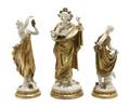 A Group of Three Continental Porcelain Figures